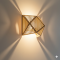 Handwoven Bamboo Wall Sconce with Geometric Starburst Shadows